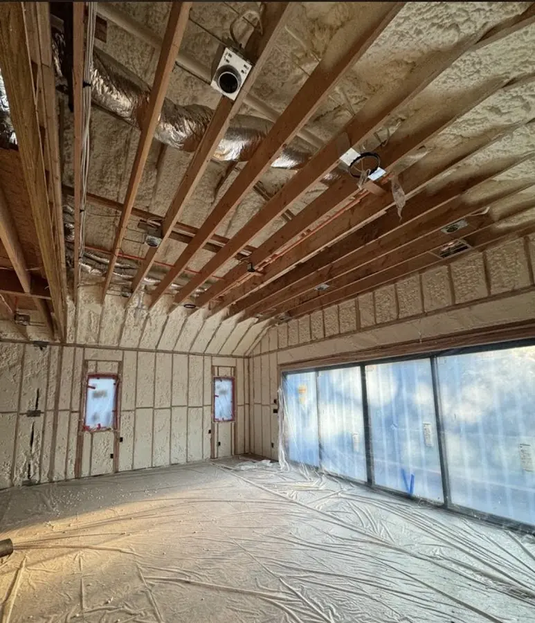 Interior walls and ceiling insulated with spray foam during new construction in Webster